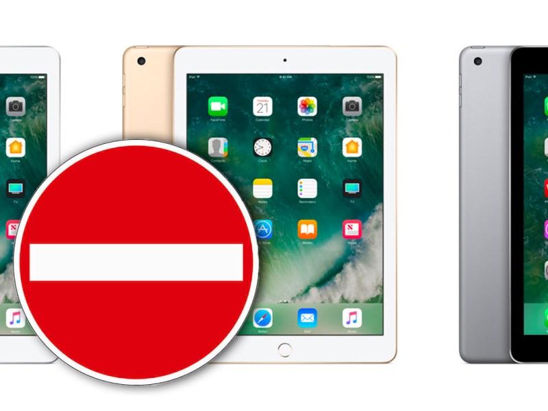 Ipads im Hintergrund, davor ein Einbahnstraßen-Verkehrszeichen.